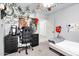 Comfortable bedroom with gray carpet, a ceiling fan, desk and decorative vines at 7431 W Mclellan Rd, Glendale, AZ 85303