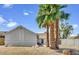 Charming home featuring palm trees, rock landscaping, and a well-maintained exterior at 7431 W Mclellan Rd, Glendale, AZ 85303