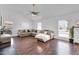 Inviting living room with natural light, wood floors and large, cozy sectional sofa at 7431 W Mclellan Rd, Glendale, AZ 85303