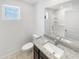 Bathroom featuring a granite vanity and a shower-tub combo at 8218 W Illini St, Phoenix, AZ 85043