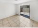 Tile bedroom with a glass door leading to a fenced back patio at 8218 W Illini St, Phoenix, AZ 85043