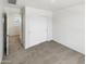 Bedroom featuring neutral carpet and a closet with sliding doors at 8218 W Illini St, Phoenix, AZ 85043