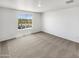 Bedroom with neutral carpet and a window with a view of trees at 8218 W Illini St, Phoenix, AZ 85043