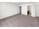 Spacious carpeted bedroom with ensuite bathroom and attached closet for easy, convenient living at 8218 W Illini St, Phoenix, AZ 85043