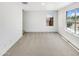 Neutral bedroom with carpet, two windows, and bright natural light at 8218 W Illini St, Phoenix, AZ 85043