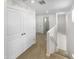 Upstairs hallway with good lighting and white doors at 8218 W Illini St, Phoenix, AZ 85043