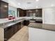 Well-equipped kitchen with granite countertops, stainless steel appliances, and island seating at 8218 W Illini St, Phoenix, AZ 85043