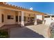 Covered back patio with a concrete floor and large support columns at 871 W Mesquite St, Gilbert, AZ 85233