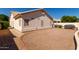 Gravel backyard with views of desert landscaping, a house and privacy walls at 871 W Mesquite St, Gilbert, AZ 85233