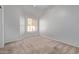 Carpeted bedroom featuring natural light from a window with white walls at 871 W Mesquite St, Gilbert, AZ 85233