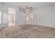 Large bedroom with arched entry and french doors to the bathroom and walk-in closet at 871 W Mesquite St, Gilbert, AZ 85233