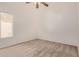 Bedroom featuring a ceiling fan, neutral-toned walls, carpeted floor, and window at 871 W Mesquite St, Gilbert, AZ 85233
