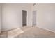 Bedroom with carpeted floor and neutral colored walls with open door to closet at 871 W Mesquite St, Gilbert, AZ 85233