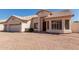 Lovely single-story home featuring a well-manicured front yard, a two-car garage, and a welcoming entrance at 871 W Mesquite St, Gilbert, AZ 85233