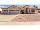 Charming single-story home featuring a well-maintained front yard, a two-car garage, and a welcoming entrance at 871 W Mesquite St, Gilbert, AZ 85233