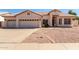 Charming single-story home featuring a well-maintained front yard, a two-car garage, and a welcoming entrance at 871 W Mesquite St, Gilbert, AZ 85233
