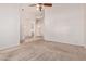 Spacious carpeted living room with neutral walls, perfect for gatherings at 871 W Mesquite St, Gilbert, AZ 85233