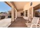 Inviting covered patio with neutral walls, ideal for relaxation and outdoor entertaining at 871 W Mesquite St, Gilbert, AZ 85233