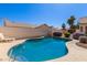 Backyard pool with ladder and surrounded by desert landscaping and privacy walls at 871 W Mesquite St, Gilbert, AZ 85233