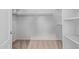 Walk-in closet with built-in shelves and hanging racks and carpeted floors at 871 W Mesquite St, Gilbert, AZ 85233