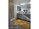 Modern bathroom featuring a double vanity, shower, and stylish decor and a yellow rug at 9205 W Williams St, Tolleson, AZ 85353