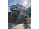 Charming two-story home with a well-manicured front yard and attached two-car garage at 9205 W Williams St, Tolleson, AZ 85353