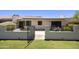 A charming gate provides access to the lush landscaping and serene common areas, inviting exploration at 10538 E Gold Dust Cir, Scottsdale, AZ 85258