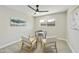 Bright bedroom with modern decor, a ceiling fan, and a view of the outdoors at 10538 E Gold Dust Cir, Scottsdale, AZ 85258