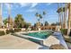 Enjoy the cool community pool with lounge chairs and palm trees, perfect for relaxation and fun at 10538 E Gold Dust Cir, Scottsdale, AZ 85258