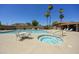 A luxurious community pool and spa with seating create a resort-style ambiance at 10538 E Gold Dust Cir, Scottsdale, AZ 85258