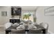 Dining room table set for six next to sliding glass doors that leads to patio and backyard at 10538 E Gold Dust Cir, Scottsdale, AZ 85258