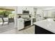 Modern kitchen with stainless steel oven, white cabinets, and an open layout to outdoor patio at 10538 E Gold Dust Cir, Scottsdale, AZ 85258
