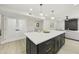 Stylish kitchen island with a white countertop and black base, situated in an open-concept living space at 10538 E Gold Dust Cir, Scottsdale, AZ 85258
