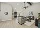 Bright and airy living room with vaulted ceilings, wood beams, a modern ceiling fan, and neutral furnishings at 10538 E Gold Dust Cir, Scottsdale, AZ 85258