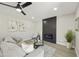 Inviting living room with contemporary decor, a modern fireplace, and plenty of natural light at 10538 E Gold Dust Cir, Scottsdale, AZ 85258