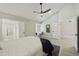 Well-lit main bedroom with vaulted ceiling, ceiling fan, and modern ensuite bathroom at 10538 E Gold Dust Cir, Scottsdale, AZ 85258