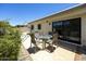Outdoor patio features a glass table with seating and a sliding glass door at 10538 E Gold Dust Cir, Scottsdale, AZ 85258
