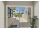 View of the beautiful and private backyard through sliding glass doors onto the covered patio at 10538 E Gold Dust Cir, Scottsdale, AZ 85258