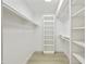 Organized walk-in closet with built-in shelving and ample storage space at 10538 E Gold Dust Cir, Scottsdale, AZ 85258