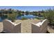 Scenic waterfront view features cozy chairs, landscaping, and tranquil canal at 10538 E Gold Dust Cir, Scottsdale, AZ 85258