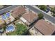 Aerial view of the backyard features a pool, grass, and plenty of privacy at 11521 E Quintana Ave, Mesa, AZ 85212