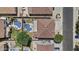 Aerial view of two properties with a pool, grass, palm trees, and privacy at 11521 E Quintana Ave, Mesa, AZ 85212