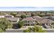 Expansive aerial shot of the home shows the manicured front lawn and neighborhood at 11521 E Quintana Ave, Mesa, AZ 85212