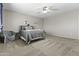 Cozy bedroom featuring a soft, neutral color palette and a ceiling fan at 11521 E Quintana Ave, Mesa, AZ 85212