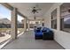 Covered patio with outdoor furniture, ceiling fans, and views of the backyard landscaping at 11521 E Quintana Ave, Mesa, AZ 85212