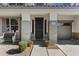 Welcoming front entry with desert landscaping, decorative pots, and a cozy bench adding to the curb appeal at 11521 E Quintana Ave, Mesa, AZ 85212
