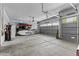 Spacious garage with a kayak, bike, surf board, water softener, and sectional garage doors at 11521 E Quintana Ave, Mesa, AZ 85212