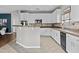 Spacious open kitchen with granite countertops, and modern white cabinetry for great storage at 11521 E Quintana Ave, Mesa, AZ 85212
