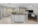 Spacious island bar open to Gathering room and dining room provides extra storage and countertop space at 11521 E Quintana Ave, Mesa, AZ 85212