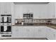 Updated kitchen featuring stainless steel appliances, ample cabinet space, and granite countertops at 11521 E Quintana Ave, Mesa, AZ 85212